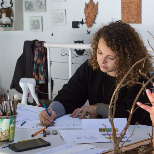 Giorgia works on designs for her sculptures