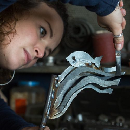 Giorgia works on a sculpture in her workshop