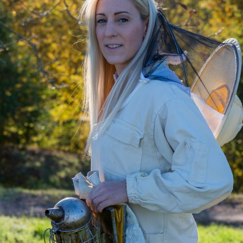 Silvia prepares to examine her hives