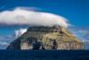 The uninhabited island of Litla Dimun seen from the ferry, Faroe Islands