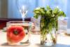 A tomato and basil sprouts decorate a table at Follina, Treviso.