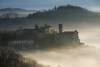 Ottiglio in early morning mist. Monferrato, Piedmont, Italy