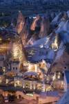 View of the town and eroded rocks of Goreme at dusk, Cappadocia, Turkey